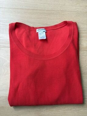 Sonia Rykiel Orange Knit with detailed shoulders on the short sleeves.